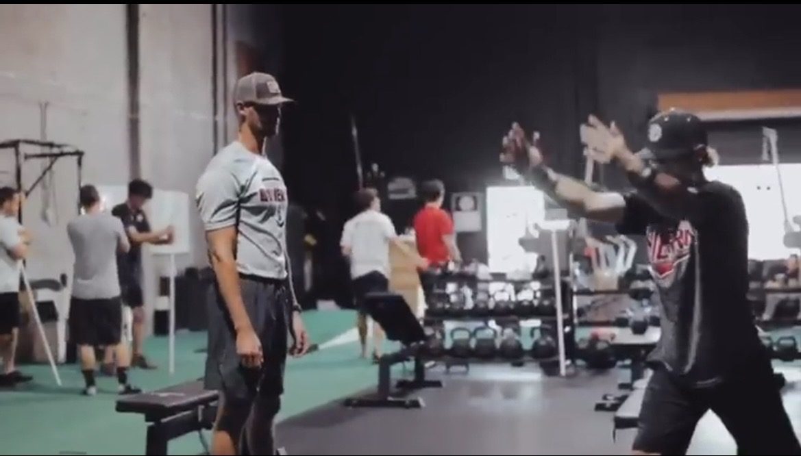 Tommy Sleva coaching a group training session